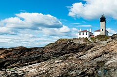 Beavertail Lighthouse Over Jagged Rocks in Rhode Island